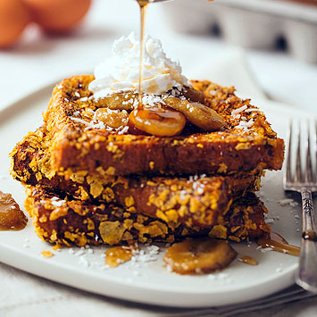Crispy French Toast with Brown Sugar Bananas, Coconut & Whipped Cream